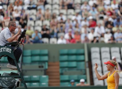 Wozniacki argues with the umpire yesterday at Roland Garros.
