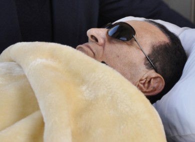 Former Egyptian president Hosni Mubarak is wheeled into court in Cairo, Egypt, for a hearing in January. State-run media are reporting Mubarak as being 'clinically dead'.