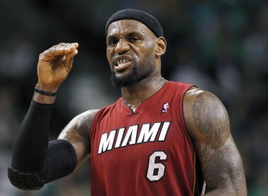 LeBron James gestures as he walks upcourt during the third quarter in Game 6 against the Boston Celtics.