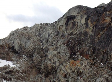 Wreckage from the crash lies strewn across the mountainside