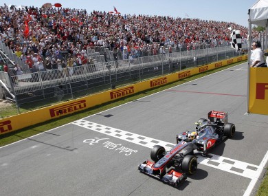 Hamilton crosses the line in Montreal.