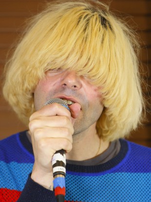 Charlatans frontman Tim Burgess performing at the Isle of Wight festival