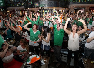 Irish fans celebrate Ireland's goal at the Submarine Bar in Crumlin, Dublin.
