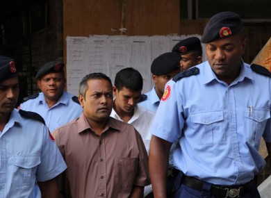 The two accused men arriving at court today accompanied by officers