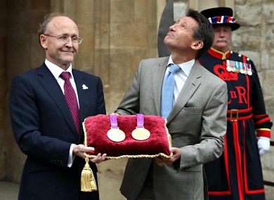 Lord Sebastian Coe, right, greets Jan du Pelessi, chairman of Rio Tinto, the official metal supplier of the London 2012 games, for storage in the vaults at the Tower.