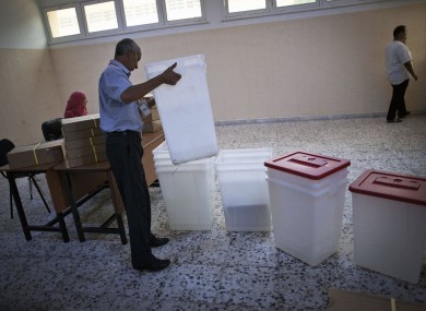 A worker prepares a polling station in Tripoli, Libya yesterday.