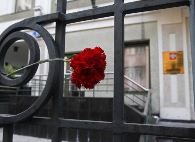 A flower is placed in memory of victims of the flood in Krasnodar region outside the office of the Representation of Krasnodar region in Moscow, Russia