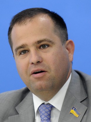 Ukrainian lawmaker Pavlo Ungurian speaks to reporters about a bill that calls for banning the
