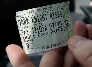 Mike Campbell, from Aurora, shows his ticket from Century 16 theater