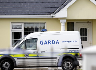 Gardaí outside the house in Harrison Place, Charleville, Co Cork on Monday.