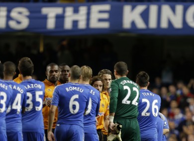 Chelsea's captain John Terry, No 26 shakes hands with the Wolves players.
