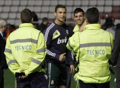 Cristiano Ronaldo poses for a photo with stadium staff after the game is called off last night.