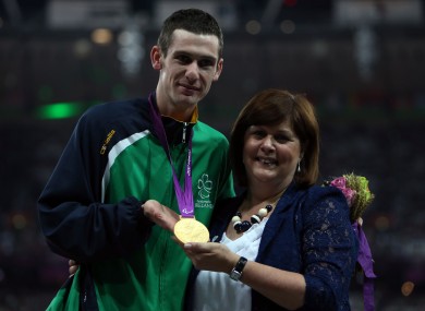 Ireland's Michael McKillop receives his Gold medal in the Mens 1500m - T37 from his mother Catherine at the Olympic Stadium.