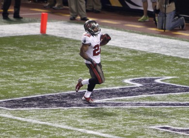Buccaneers running back Doug Martin runs in the end zone after scoring on a 64-yard TD reception.
