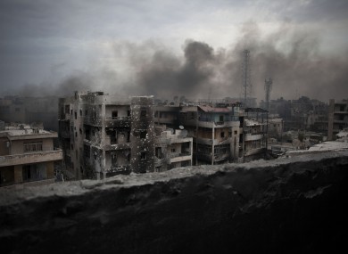 Smoke rises over Saif Al Dawla district, in Aleppo, Syria - 2 Oct 2012.