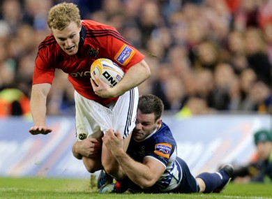 Leinster's Fergus McFadden tackles Keith Earls of Munster.