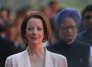 Australian Prime Minister Julia Gillard, arrives with her Indian counterpart Manmohan Singh, at the Indian Presidential palace for ceremonial reception, in New Delhi, India , Wednesday, October. 17.