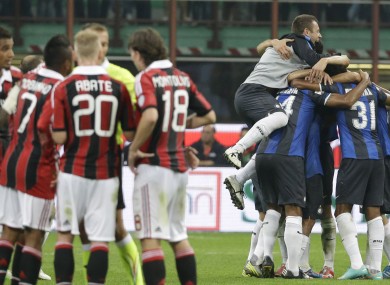 The Inter players celebrate at the final whistle.