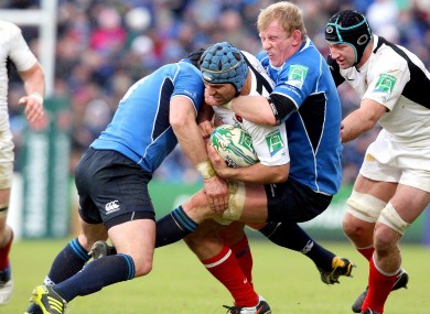 Shane Jennings and Leo Cullen double up on Schalk Brits in 2011.