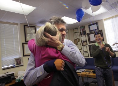 Robert Lefkowitz hugs his administrative assistant of 35 years Donna Addison in his office after hearing that he had won.