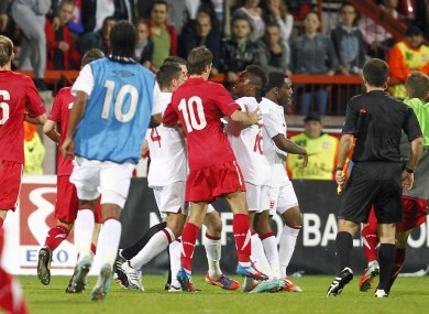 A brawl erupts at the end of England's U21 match against Serbia.