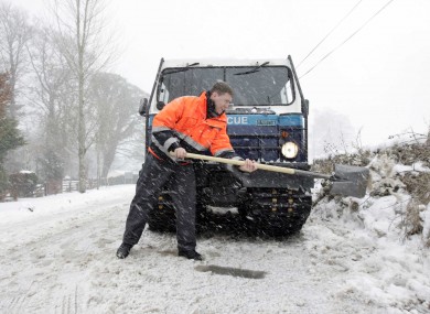 A member of the Dublin Civil Defence shovelling snow during the bigg freeze in 2010.