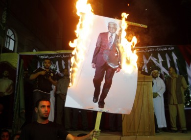 Palestinians march during a protest against president Mahmoud Abbas in the Jabaliya Refugee Camp, northern Gaza Strip Saturday, Nov. 3, 2012.