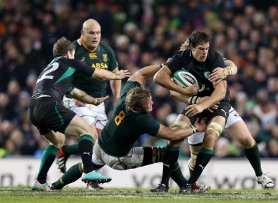 Mike McCarthy tests the Springbok defence with a charge.
