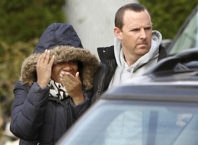 Glenda Moore, and her husband, Damian Moore, react as they approach the scene where at least one of their childrens' bodies were discovered in Staten Island last Thursday.