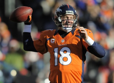 Denver Broncos quarterback Peyton Manning sets to throw a pass in the second quarter of an NFL football game against the Cleveland Browns.