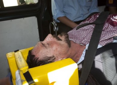 McAfee in an ambulance on his way to hospital.