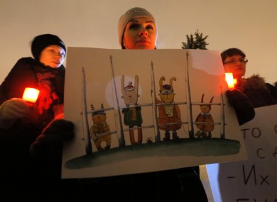 Opposition activists protest against a bill banning US adoptions of Russian children in St.Petersburg, Russia.