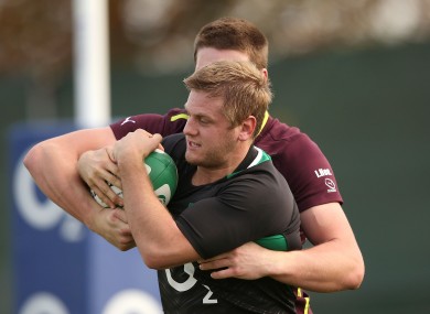 Chris Henry wrestles for possession with Ulster teammate Iain Henderson.