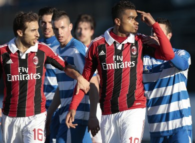 C Milan Ghana midfielder Kevin-Prince Boateng, right, is flanked by his teammate Mathieu Flamini as he gestures towards the crowd in Busto Arsizio yesterday.