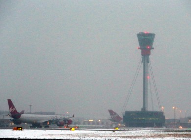 Planes taxi at Heathrow Airport.
