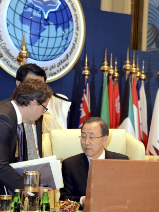 Ban Ki-Moon confers with colleagues during the opening of the International Humanitarian Pledging Conference for Syria in Kuwait today.