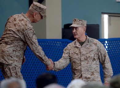 US Marine Gen. Joseph F Dunford, right, shakes hand with outgoing NATO commander US Gen John Allen, left.