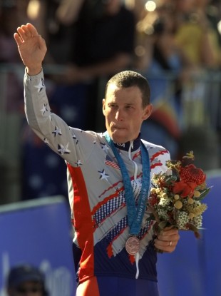 Lance Armstrong waving after receiving the bronze medal in the men's individual time trials at the 2000 Summer Olympics.