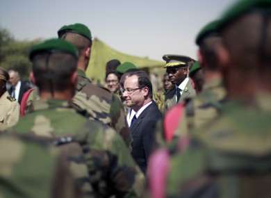 French President Francois Hollande addresses the troops at the airport following his two-hour-long visit to Timbuktu, Mali.