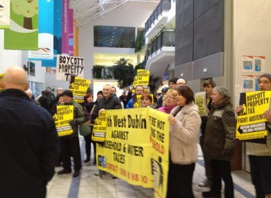 Demonstrators against property taxes and water charges protest at South Dublin County Council's monthly meeting in Tallaght.