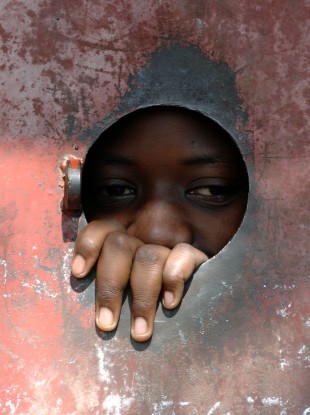 A child living in one of Kampala's many outlying slum settlements, Uganda.