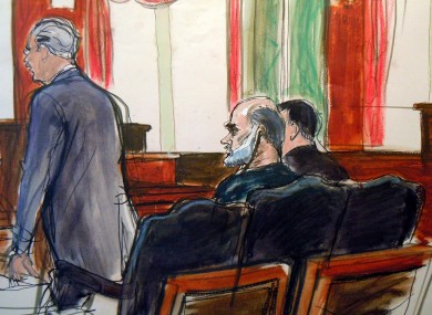 In this courtroom sketch, Osama bin Laden's son-in-law, Sulaiman Abu Ghaith, center, listens as court-appointed federal defender Philip Weinstein, left, speaks in U.S. Federal court Friday, March 8, 2013.