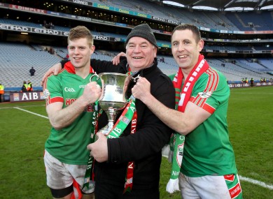 St Brigid’s Darren Dolan and Frankie Dolan celebrate with Frankie Dolan Snr. after the game.