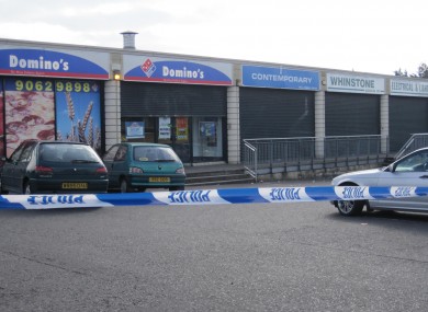A general view of the area outside Domino's Pizza in the Turf Lodge area in the west of Belfast where pizza delivery Kieran McManus driver was killed when he was gunned down at close range in front of three close friends.