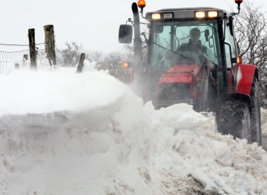 A tractor attempts to clear drifting snow in the hills above the Glens of Antrim over the weekend.