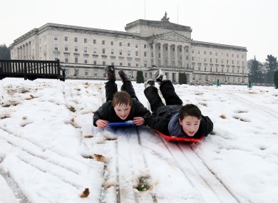 Andrew Hagan (left), and Dillon Lennox, both aged 11, enjoy the snow in the Stormont estate in Belfast yesterday.