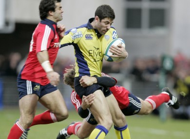 Clermont's Julien Malzieu is tackled by Munster's Shaun Payne (right) and Brian Carney.