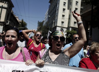 Municipal workers chant anti-austerity slogans during a protest against government plans to lay off thousands of public sector workers.