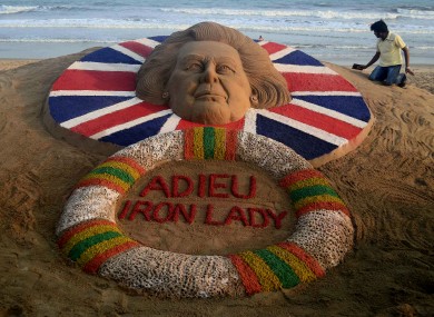 Indian sand artist Sudarshan Pattnaik gives finishing touches to his sand sculpture at the golden beach of Puri