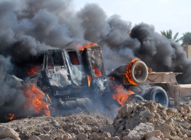 A burning Iraqi army military vehicle, , April 23, 2013.